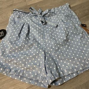 Paperbag waist style. Elastic waist . Polka dot light blue shorts